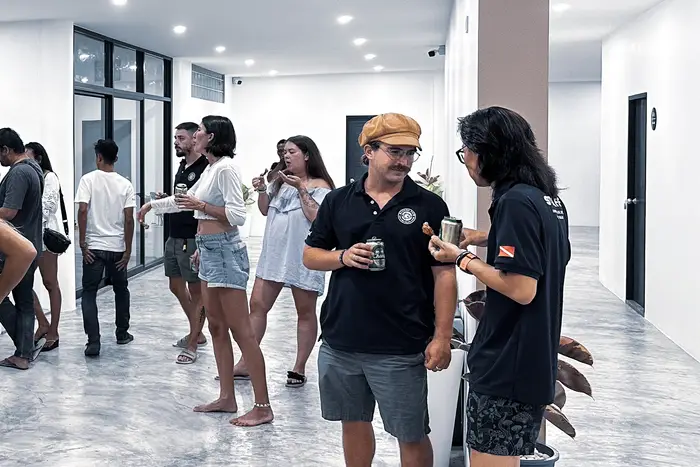 Guests gathered in the lobby in the evening, drinks in hand